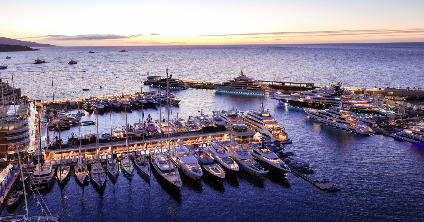 Motor yachts berthed in Port Hercule at dusk
