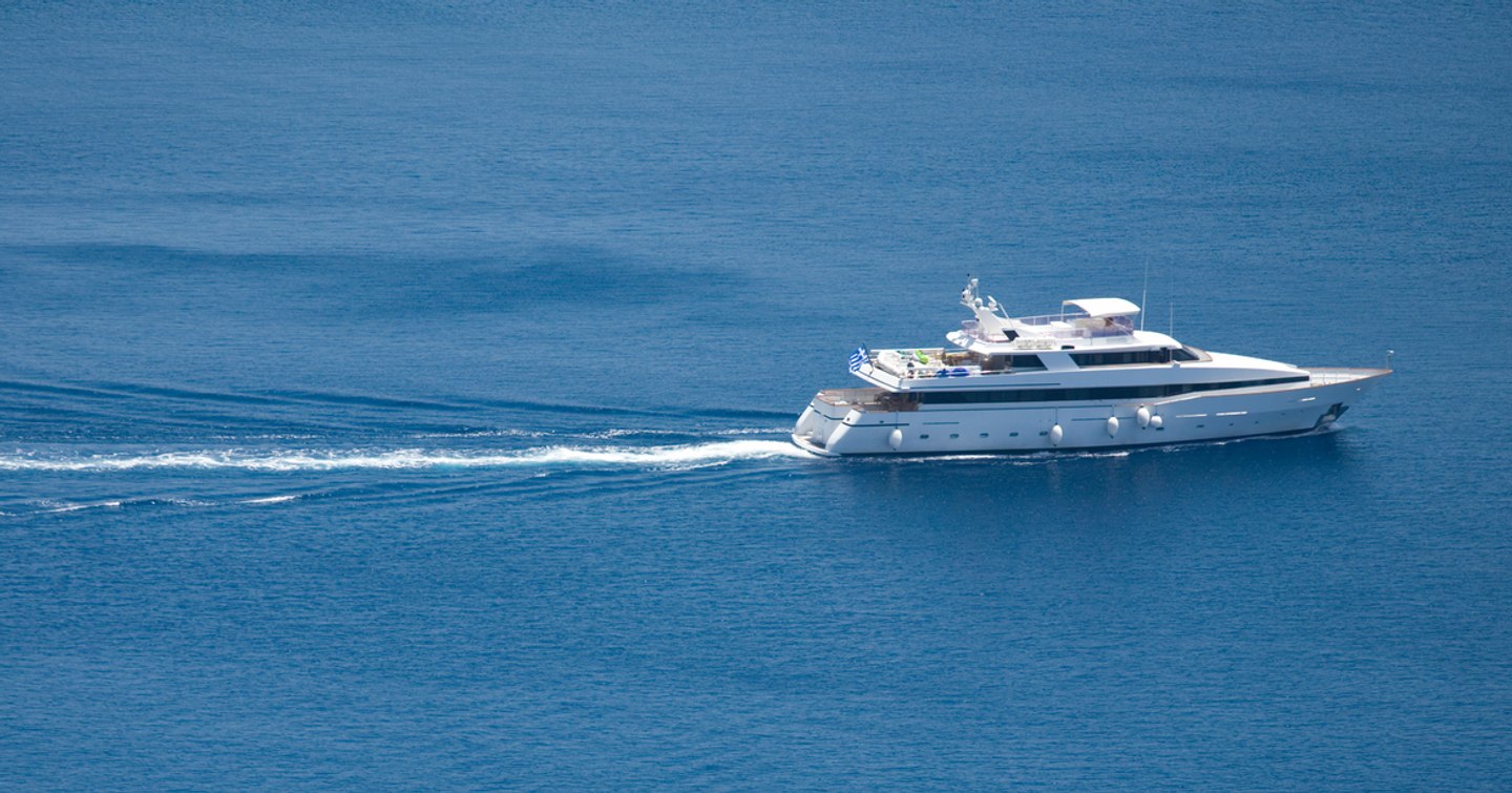 Superyacht underway side view 