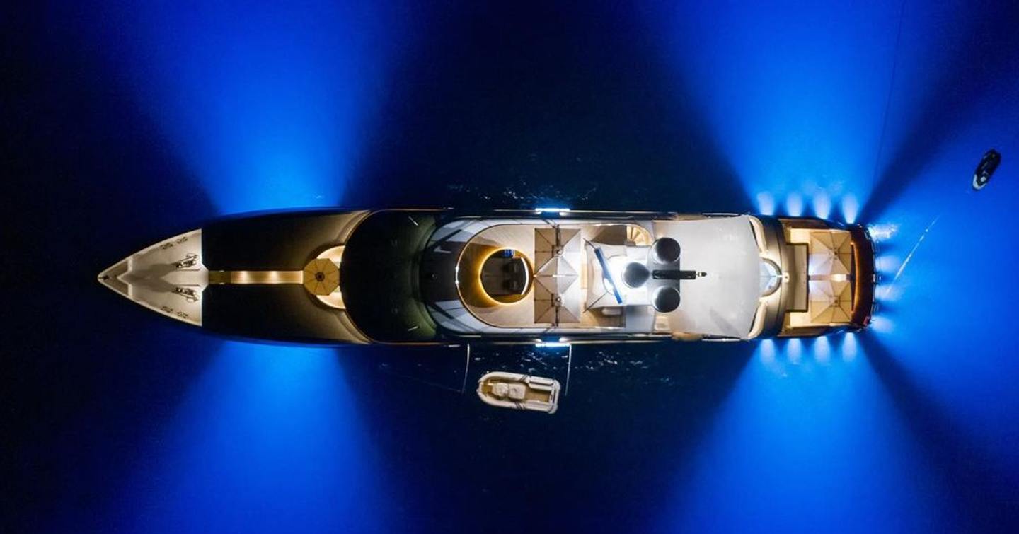 View from directly above of Trinity Yacht superyacht lit up at night