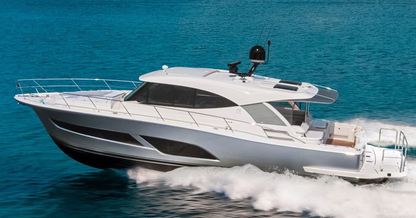 Riviera 505 SUV motor yacht underway side view 