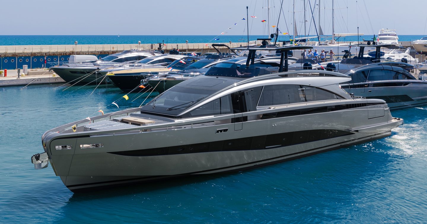 First Pershing GTX90 motor yacht at anchor side view 