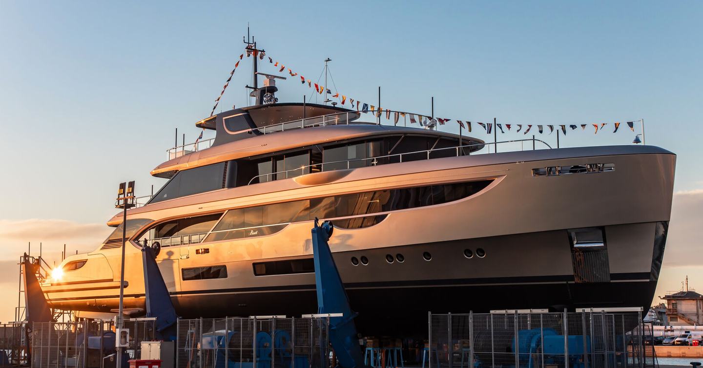 Superyacht Solusa at launch ceremony with bunting 