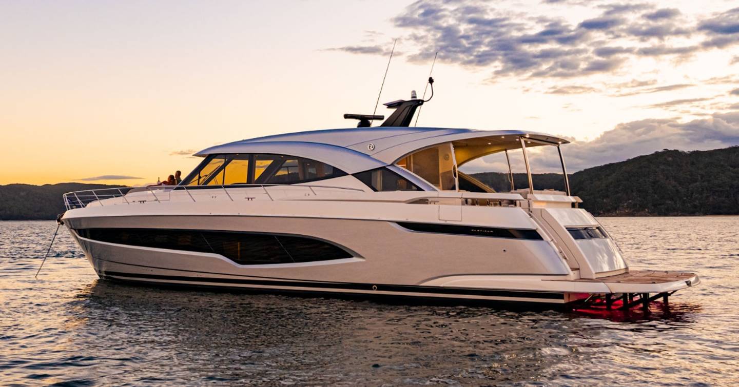 Riviera 6200 yacht at anchor side view 