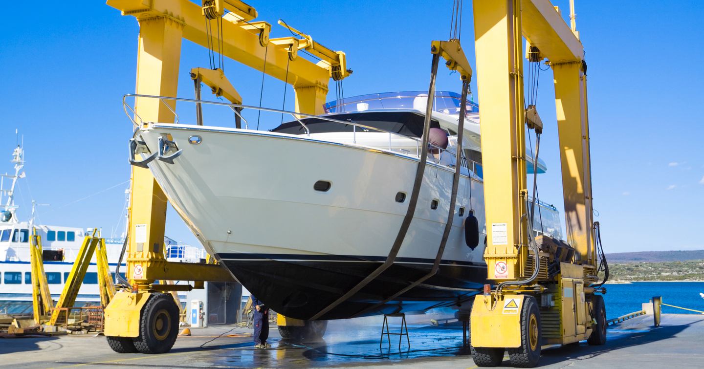 Boat being lifted at shipyard 