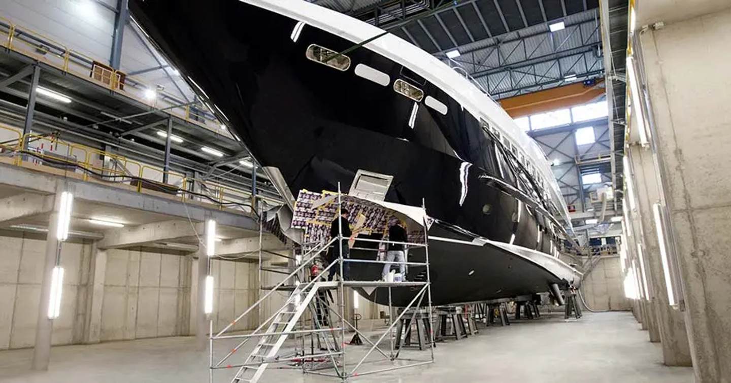 Superyacht in shipyard under construction 