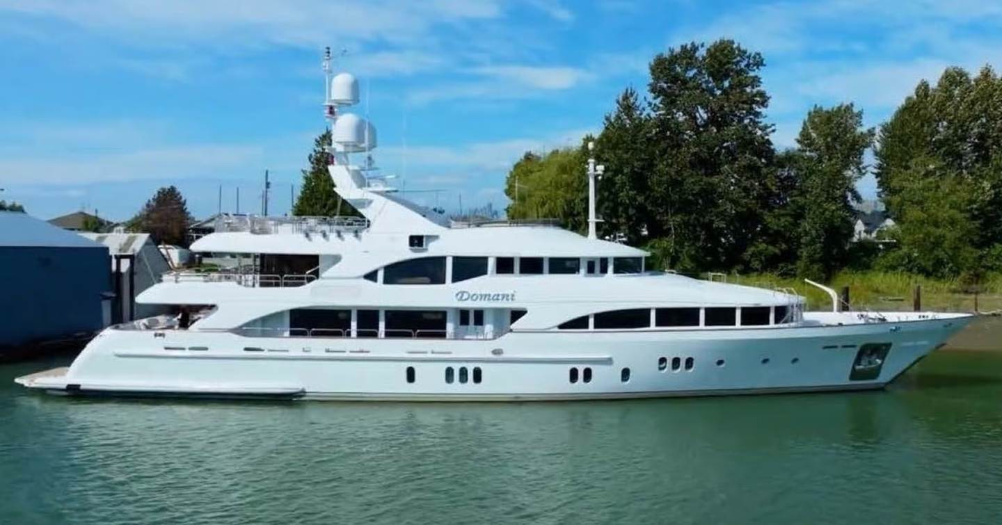 Benetti motor yacht Domani at anchor side view 