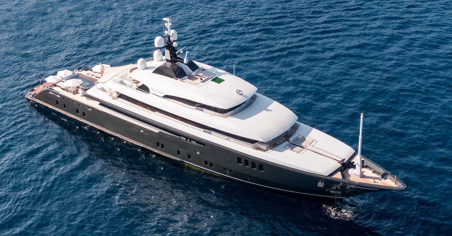 The Icon Yachts superyacht LOON from above, sitting at anchor in a dark blue sea