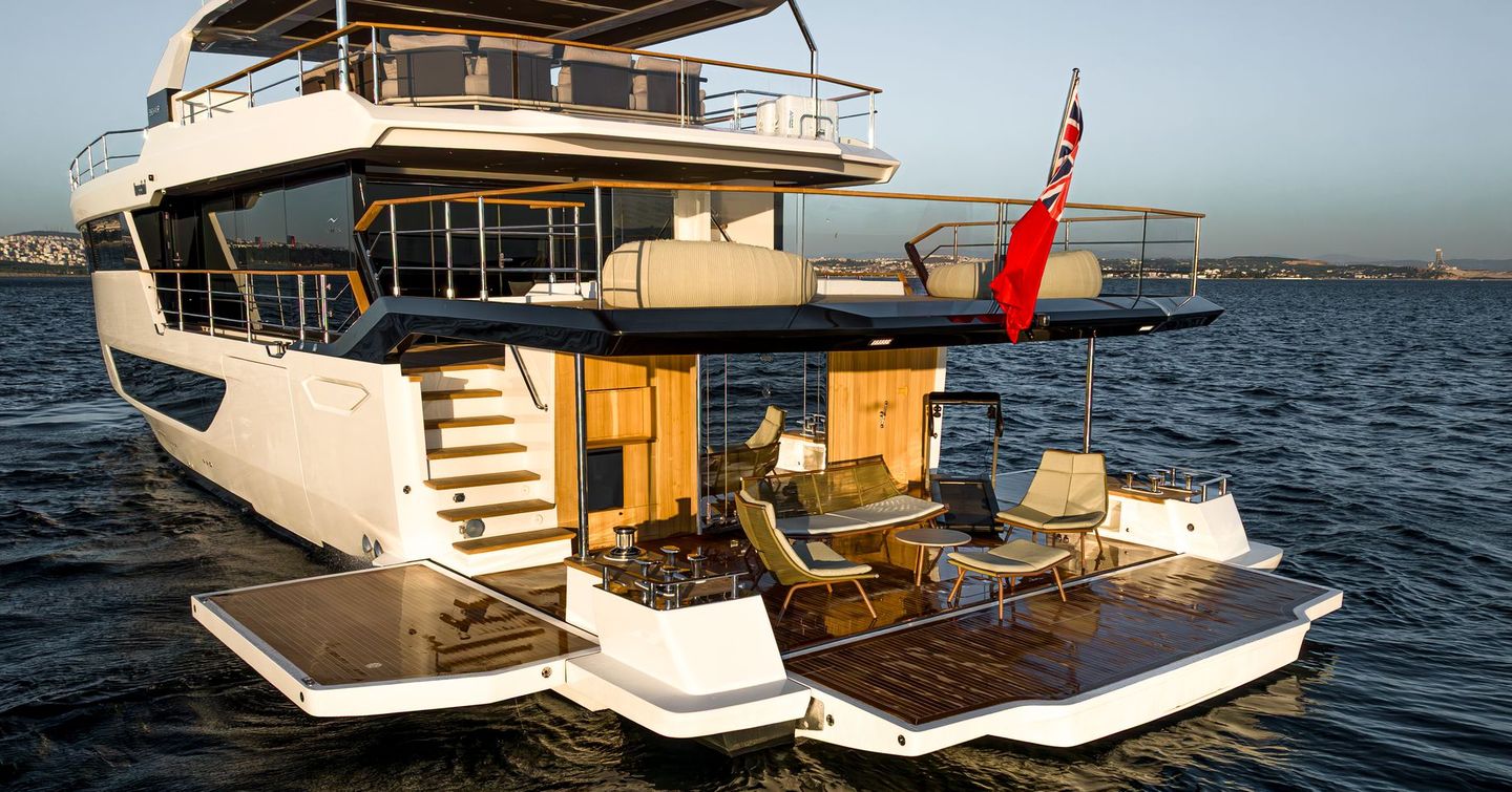 Superyacht Tuccini stern with extended beach club and alfresco dining 