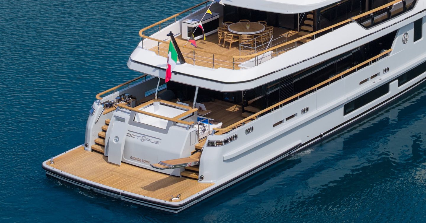 Cantiere delle Marche motor yacht Octopus at anchor view of beach club 
