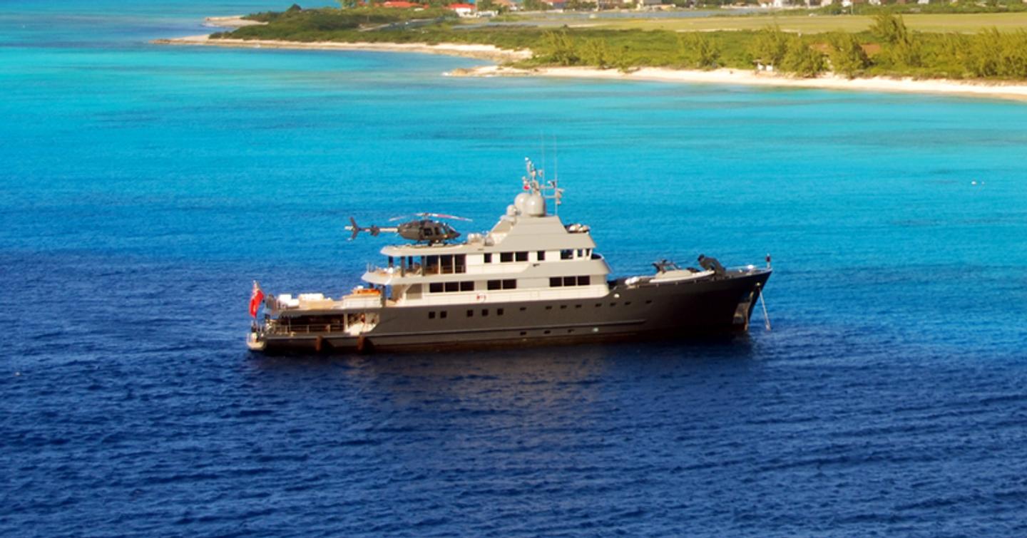 Explorer yacht at anchor side view 