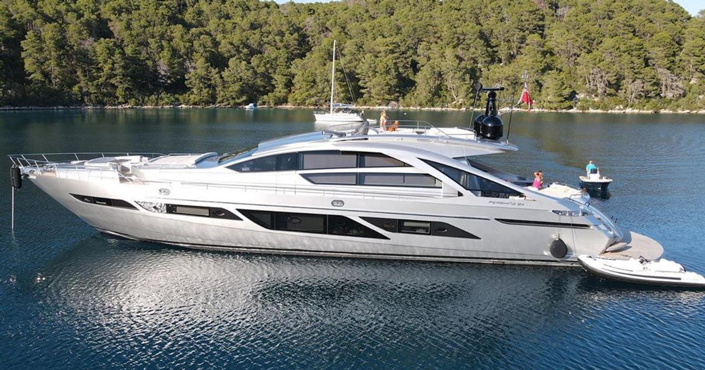  Pershing motor yacht Queen B Sport at anchor side view 