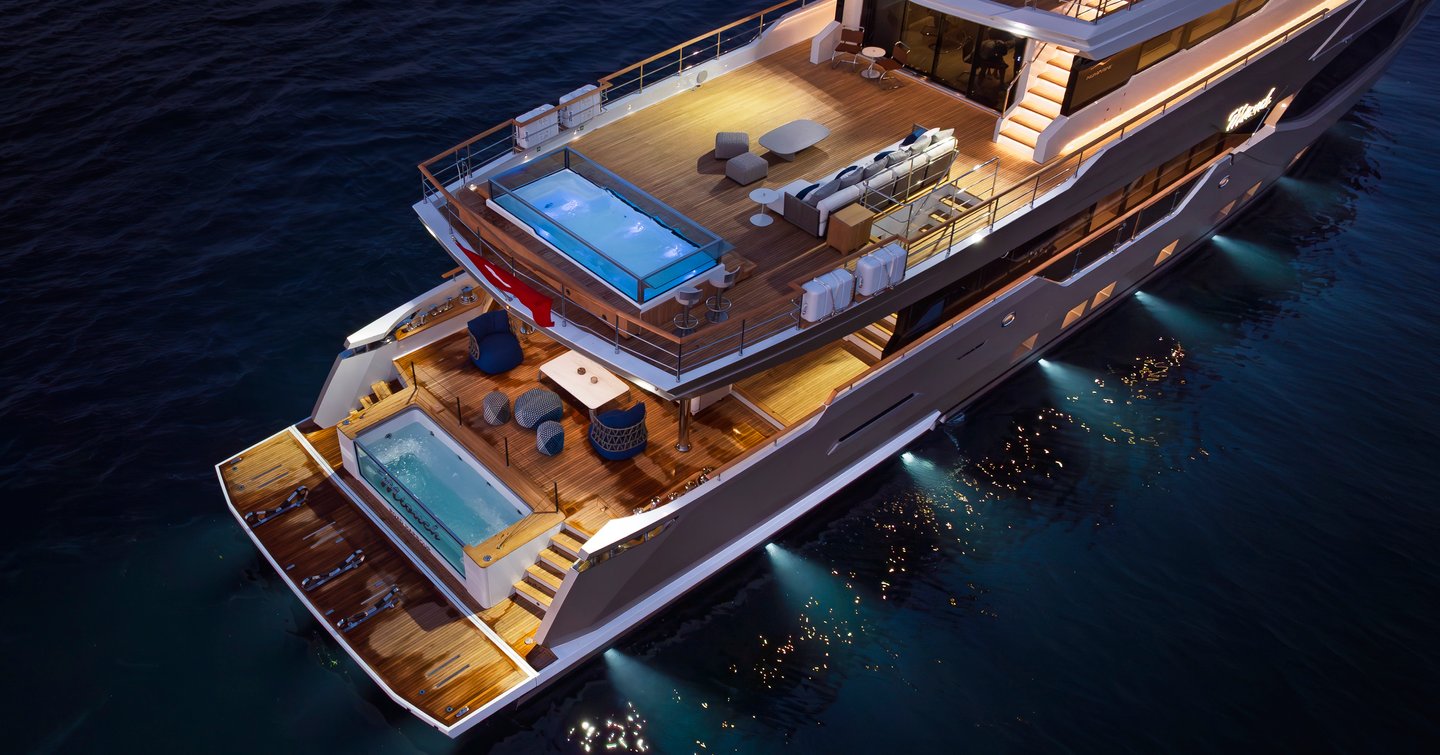 Numarine 40MXP explorer yacht stern with double swimming pools at night and underwater LEDS