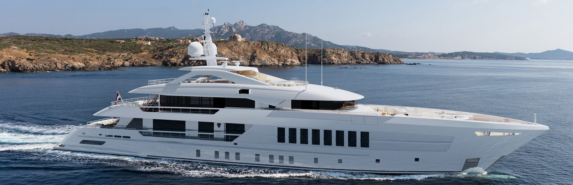 Heesen superyacht on water with coastline in background