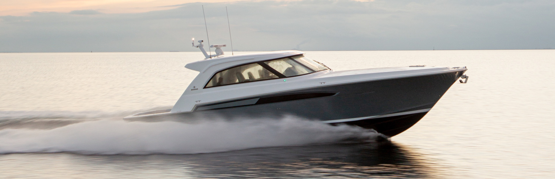 Bertram boat moving at speed on water