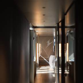 Alia Superyacht Ximena hallway with warm lighting 