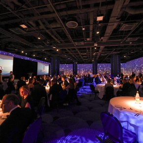 International Yacht and Aviation Awards ceremony with dim blue lighting