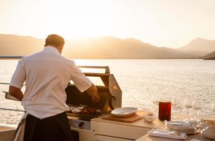 yacht chef preparing deck barbecue BBQ