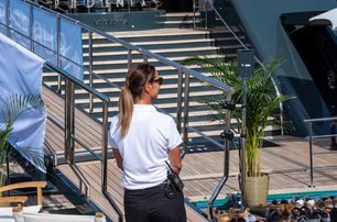 yacht crew wearing sunglasses on dock