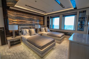 Twin cabin on superyacht TATIANA with view out to see