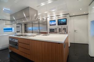  Baglietto superyacht Tin Tin galley with warm wood detailing 