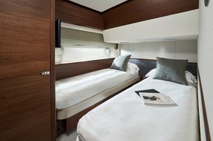 Princess F65 motor yacht guest cabin with twin beds