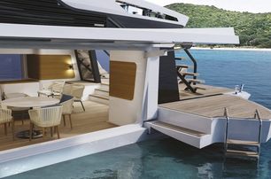 Mangusta Oceano 39 shot from water level looking towards beach club waterside aft deck area with side wing balconies extended