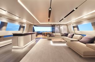 Baglietto yacht range DOM133 interior salon shot looking forward, illuminated lighting features by floor and cabinetry