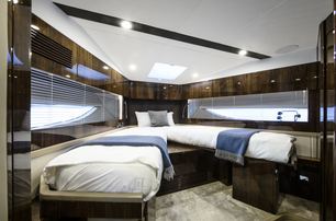 two berths with white line and high-gloss wooden wall panels make up the twin cabin on board the Targa 45 model