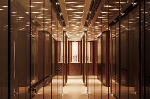 Sanlorenzo 74Steel superyacht Silver Fox lobby with warm integrated lights and mirrored walls 