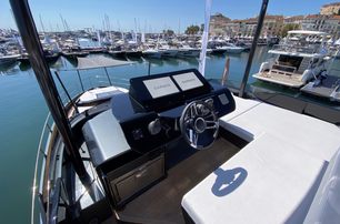 Sessa Marine F60 Flybridge helm station on flybridge shown, yachts in background