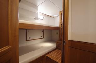 Fleming 85 twin crew cabin with upper and lower berths and ensuite access