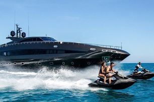 two PWC jet ski in front of superyacht