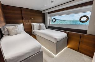 Custom Line superyacht Lumpasaurus guest cabin with twin beds