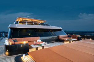 100 Sunreef Power night time shot of bow seating area, with gentle illumination