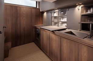 Arksen 55 motor yacht galley with warm wood interior 
