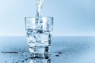 fresh drinking water into glass