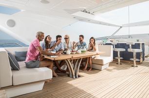 Sunseeker 116 Yacht flybridge dining area with crew-served outdoor table