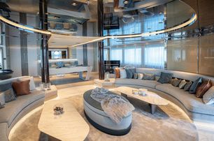 Interior of superyacht TATIANA with sofas and tables visible