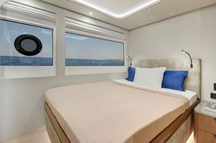 Lazzara LPC 300 catamaran guest cabin with windows 