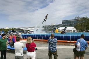 A flyboarding demonstration in action with spectators in the foreground