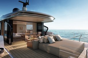 Azimut Seadeck 7 upper deck aft shot showing sun pads and seating, approaching sunset