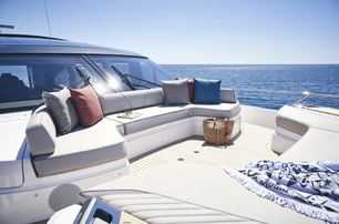 An exterior lounging area on board a Princess V78 superyacht