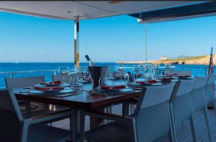 Custom Line motor yacht On aft deck dining area 
