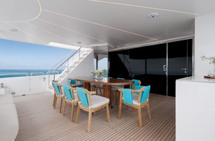 Covered seating and table on aft deck of Crowned Eagle