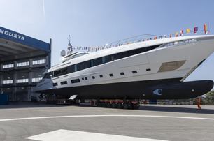 The Overmarine superyacht EL LEON leaving a construction shed.