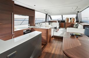 Princess F65 motor yacht open plan view of galley and lounge areas