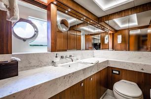 Sunseeker motor yacht Tatis master en suite with wood and marble details 