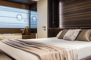 A guest cabin on board a Ferretti 670 motor yacht.