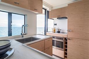 Beneteau Grand Trawler 63 motor yacht galley with large windows 