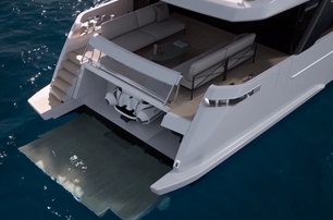 Sanlorenzo-SL86A mid aerial show over aft deck with bathing platform lowered into water, and the tender showing in its storage within transom